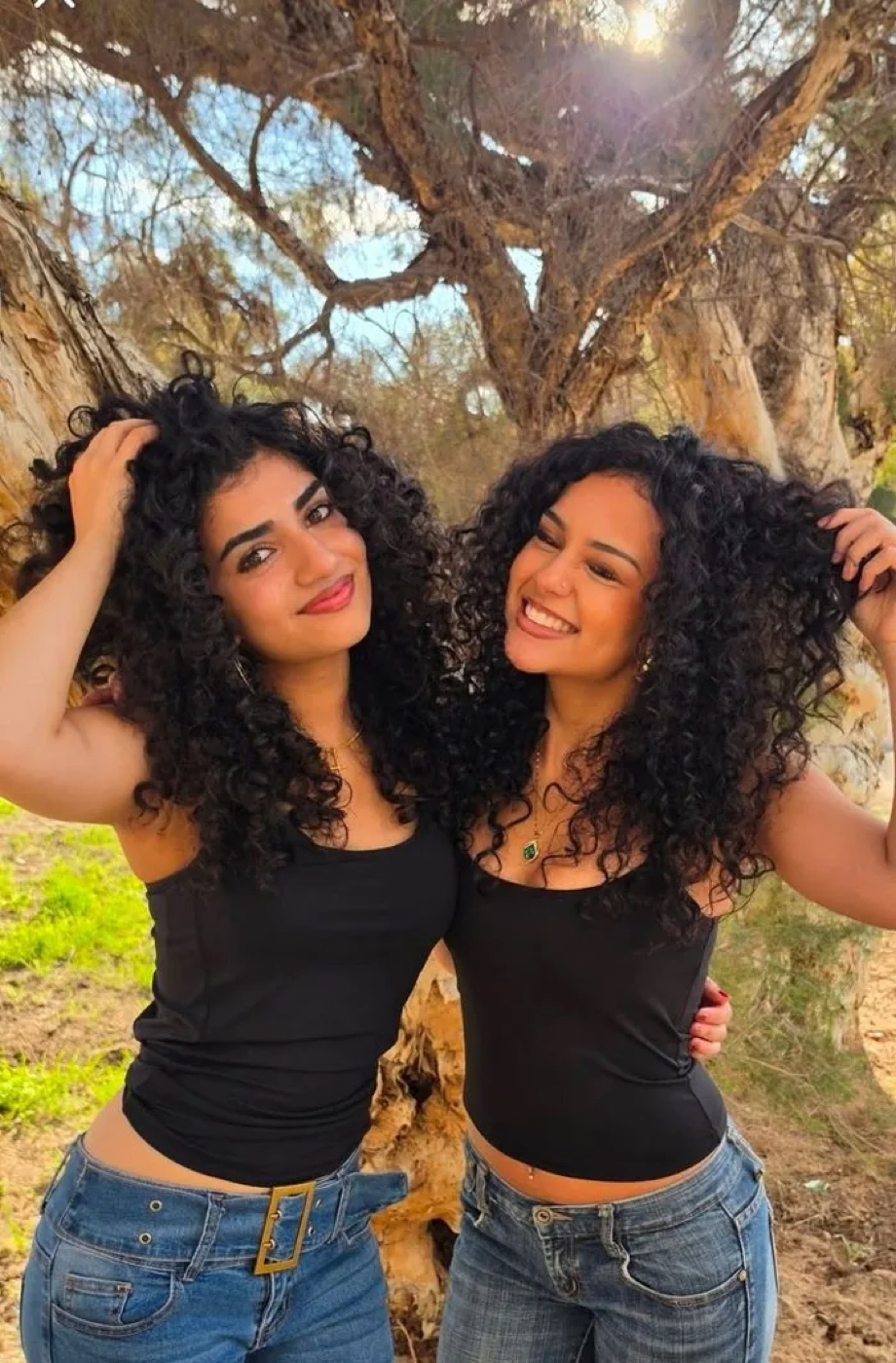 Two Aoki Hair clients showing defined, healthy natural curls.